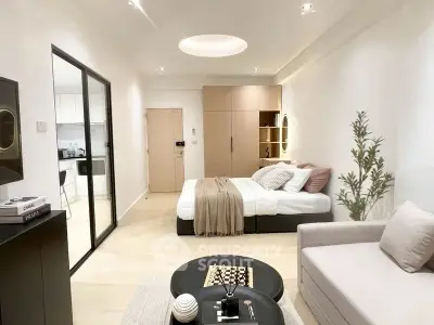 Modern studio apartment with cozy bedroom and stylish decor