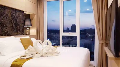 Luxurious bedroom with stunning city view and elegant decor