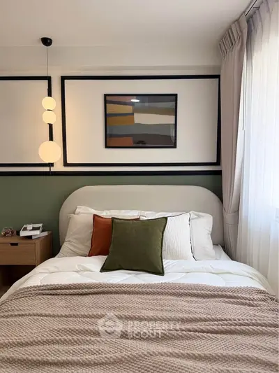 Cozy bedroom with modern decor, featuring a stylish bed, bedside table, and elegant lighting.