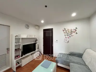 Cozy living room with modern decor and butterfly wall art