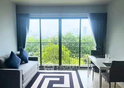 Bright living room with large windows and city view, modern furniture and stylish decor.