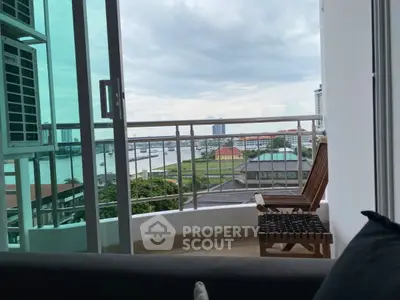 Charming balcony with stunning city and river view, perfect for relaxation and enjoying the skyline.