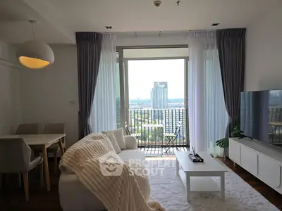 Modern living room with balcony view in high-rise apartment