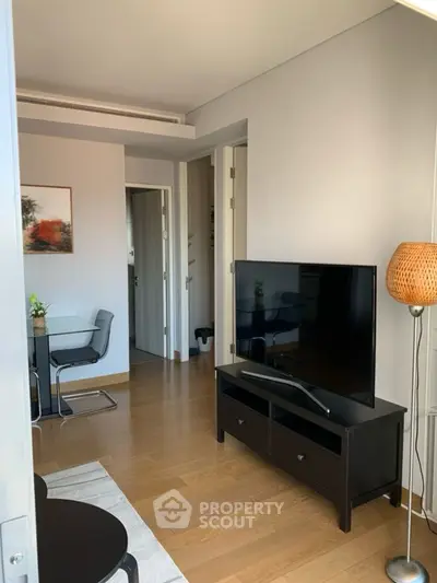 Modern living room with sleek TV stand and stylish dining area
