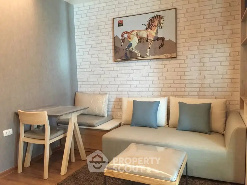 Cozy living room with modern decor and stylish furniture, featuring a unique horse artwork on a brick accent wall.