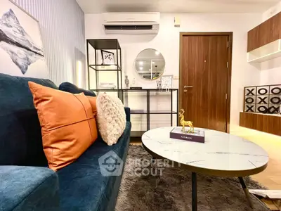 Stylish living room with modern decor, cozy sofa, and elegant coffee table.