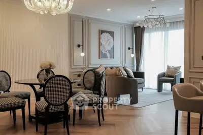 Elegant living room with stylish furniture and modern decor, featuring a cozy seating area and chic dining set.