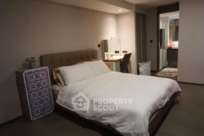Spacious modern bedroom with elegant decor and ensuite bathroom