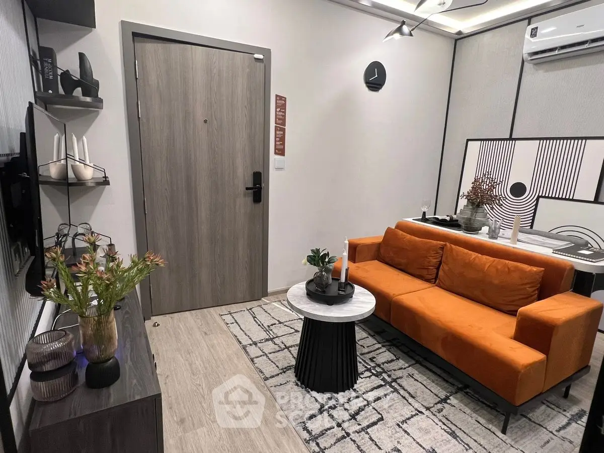 Modern living room with vibrant orange sofa and stylish decor