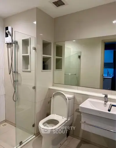 Modern bathroom with glass shower and sleek fixtures