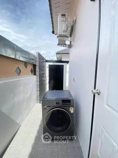 Outdoor laundry area with washing machine and modern design
