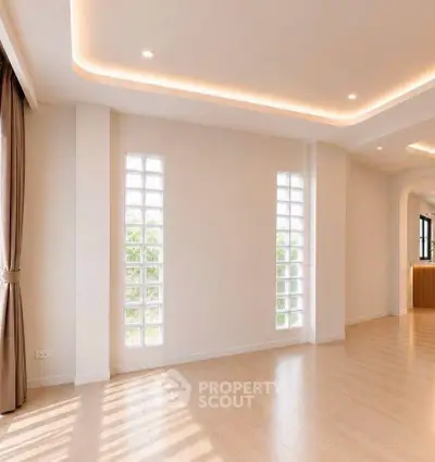 Spacious modern living room with elegant lighting and large windows