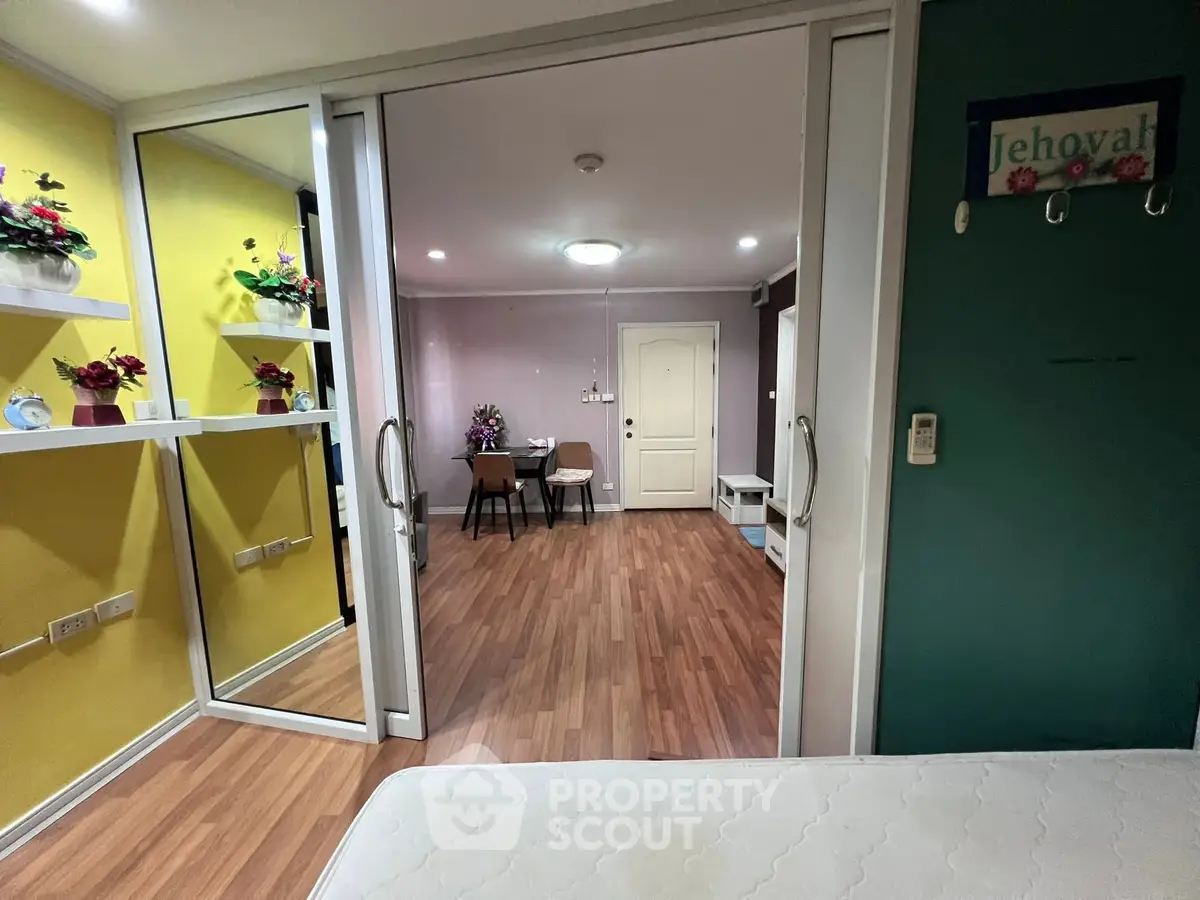 Modern apartment interior with vibrant colors and wooden flooring