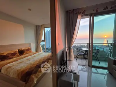 Stunning ocean view from modern bedroom with balcony at sunset
