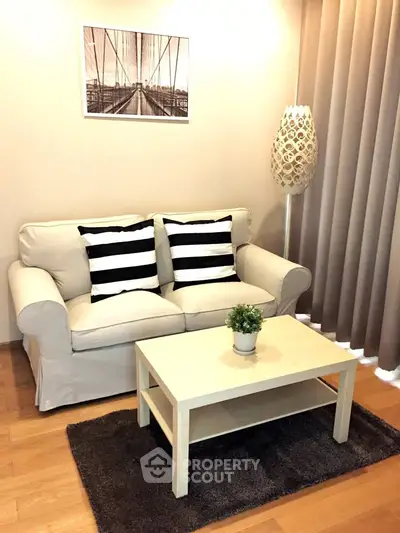 Cozy living room with stylish sofa, modern decor, and warm lighting