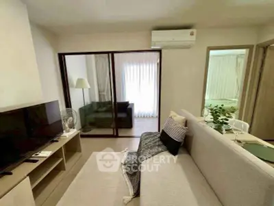 Modern living room with cozy sofa, TV, and air conditioning in stylish apartment.