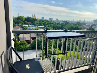 Charming balcony with stunning cityscape view, perfect for relaxation and enjoying the skyline.