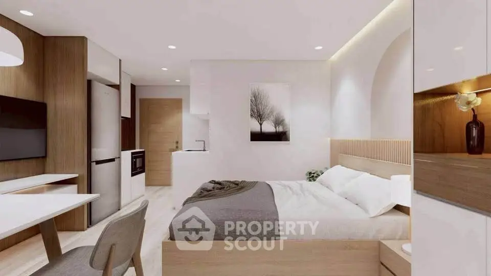 Modern studio apartment with stylish decor and integrated kitchen area.