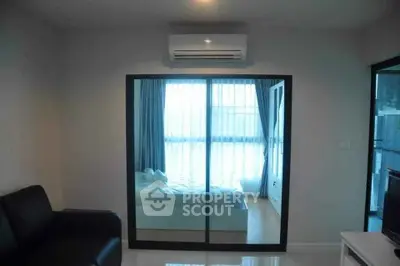 Modern bedroom with mirrored wardrobe and air conditioning in a stylish apartment.