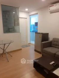 Cozy modern living room with sleek furniture and ample natural light, perfect for urban living and relaxation.