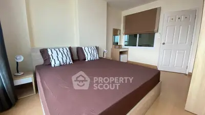 Cozy bedroom with modern decor and ample natural light