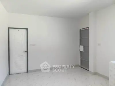 Minimalist empty room with white walls and marble floor, ready for customization.