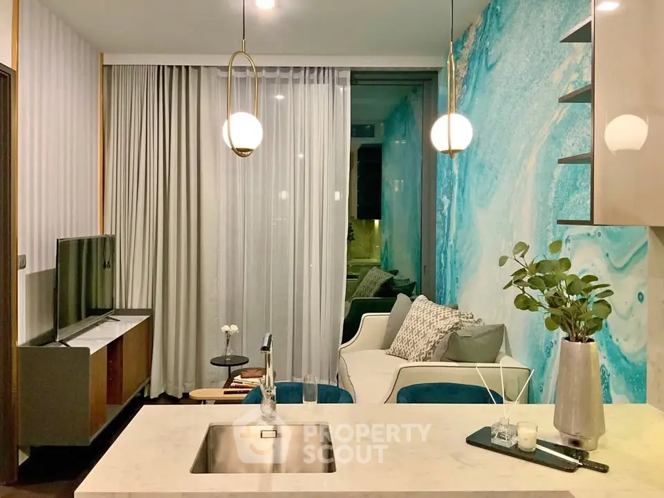 Modern living room with stylish decor and open kitchen layout