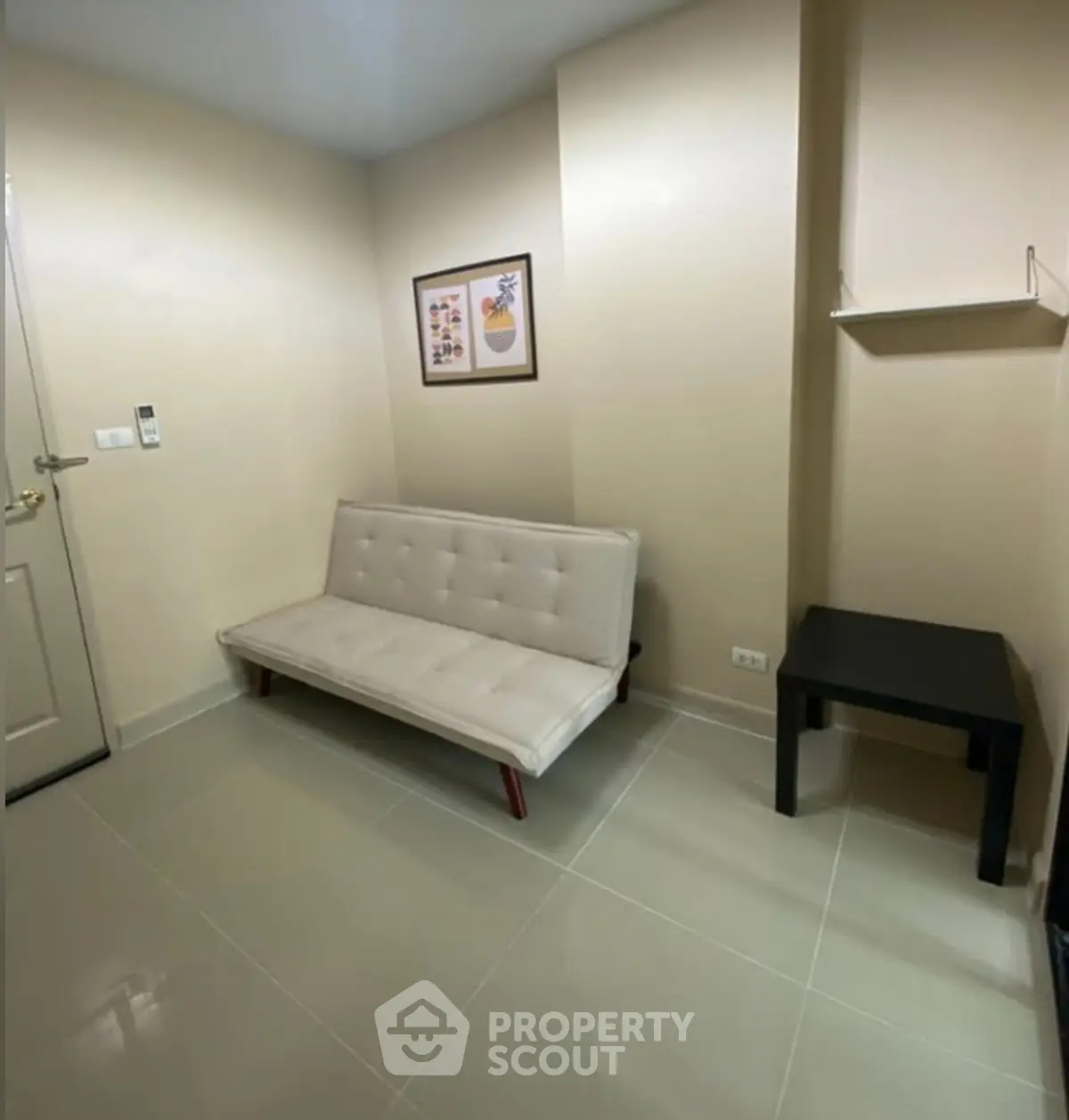 Cozy minimalist living room with modern sofa and wall art