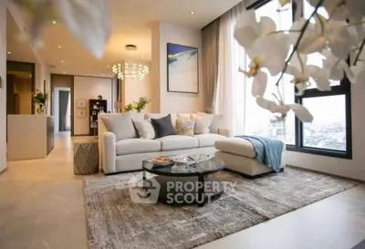 Luxurious modern living room with elegant decor and stunning city view.