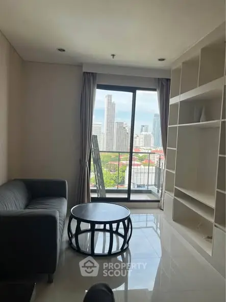 Modern living room with city view and sleek furniture in high-rise apartment