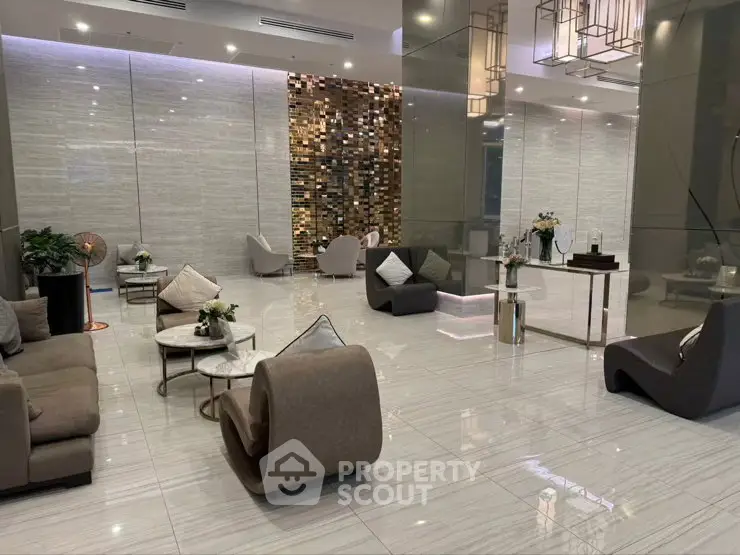 Luxurious modern lobby with elegant seating and stylish decor, perfect for welcoming guests in a high-end building.