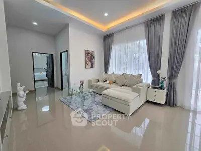 Spacious modern living room with elegant decor and large windows