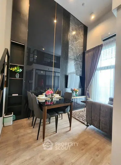 Modern living room with high ceiling and elegant dining area