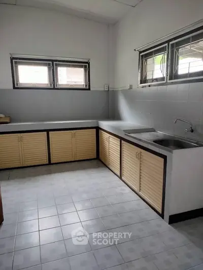 Spacious kitchen with ample counter space and natural light