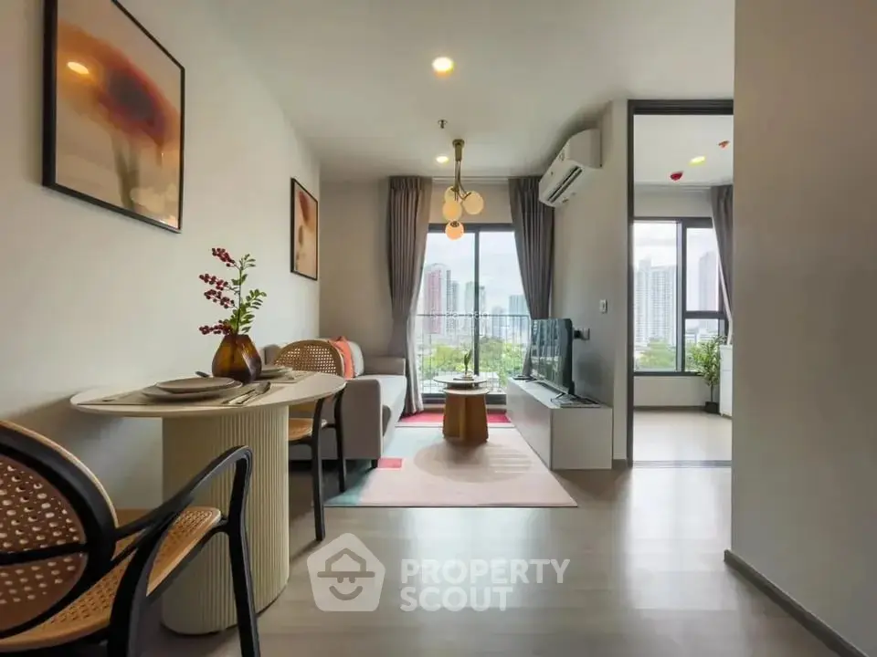 Modern living room with city view, stylish decor, and open layout