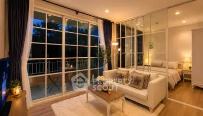 Elegant living room with large windows and cozy bedroom view