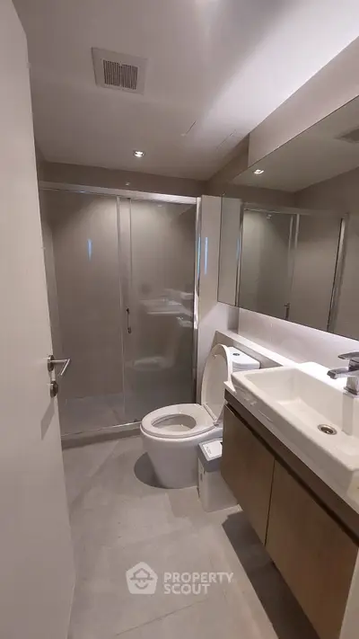 Modern bathroom with sleek shower and contemporary fixtures