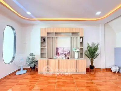 Modern living room with stylish wooden cabinetry and elegant decor