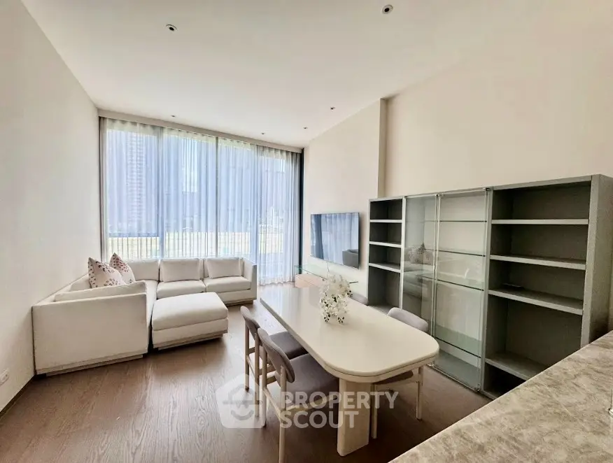 Spacious modern living room with elegant furniture and large windows