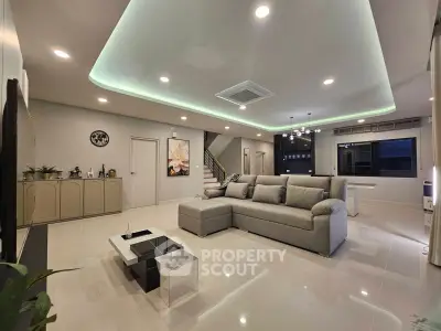 Spacious modern living room with elegant lighting and stylish decor