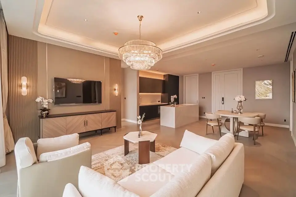 Luxurious open-plan living room with elegant chandelier and modern furnishings