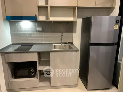 Modern kitchen with sleek cabinetry and stylish backsplash