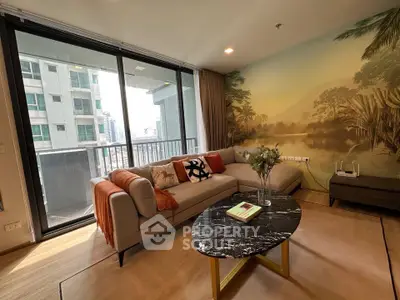 Luxurious living room with modern decor and stunning balcony view in high-rise apartment.