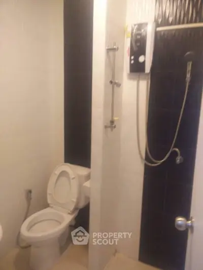 Modern bathroom with shower and toilet in sleek design
