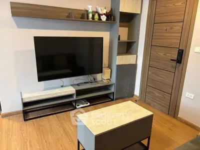 Modern living room with sleek TV setup and stylish wooden accents