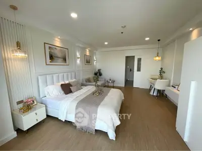 Luxurious bedroom with elegant decor and modern furnishings in a spacious apartment.
