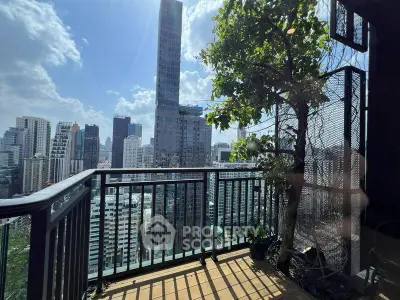 Stunning cityscape view from a high-rise balcony with lush greenery and modern architecture.