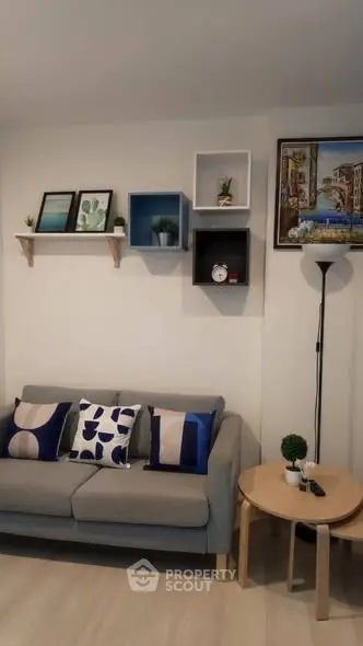 Stylish living room with modern decor and cozy seating area.