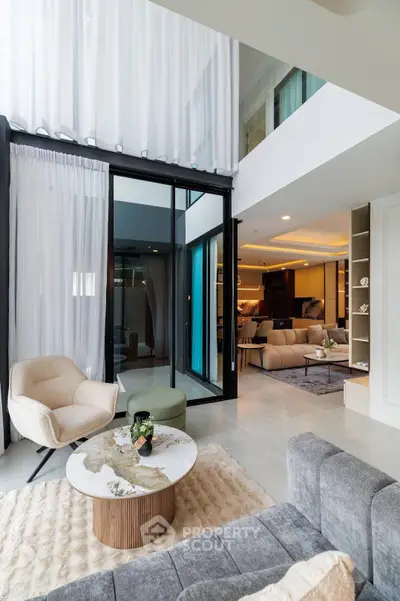 Luxurious modern living room with high ceilings and elegant decor