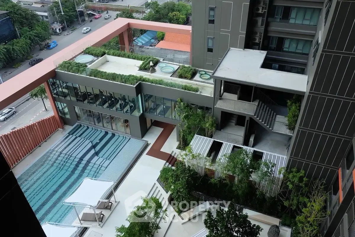 Modern apartment complex with rooftop garden and swimming pool